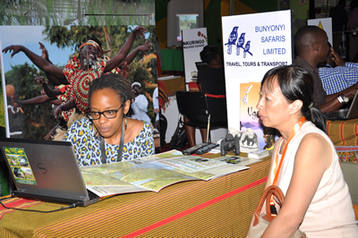 An exhibitor with a hosted buyer during MKTE event in Diani. About 35 countries were represented in the exposition to showcase Kenya’s tourism products.